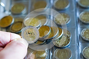 Transparent blister album page with coin collection of 2 euro commemorative coins