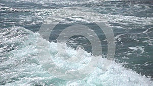 Transparent blue-green sea and white-capped waves. Slow motion