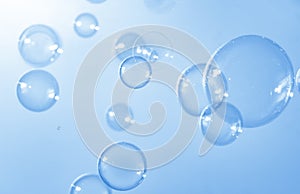 Transparent Blue Soap Bubbles Floating Background.