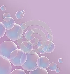 Transparent blue soap bubbles on pink