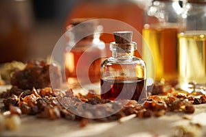 A bottle of essential oil with myrrh resin