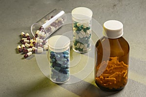 transparent bottle with medicine capsules