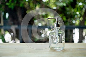 Transparent bottles for Shampoo, Soap or other cosmetic on wood table