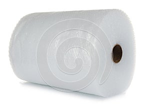 Transparent bubble wrap roll isolated on white