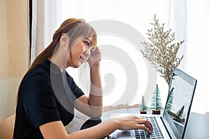 transparent businesswoman dressed in black uses a laptop to work