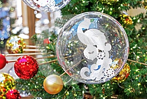 Transparent Christmas ball with a white firebird inside