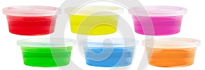 Transparent colorful slimes in plastic boxes isolated