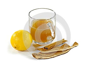 Transparent cup with Reishi tea.Dried lingzhi mushroom Also called as Reishi mushroom in Japan, Lingcheu in Thailand, Lingzhi mus