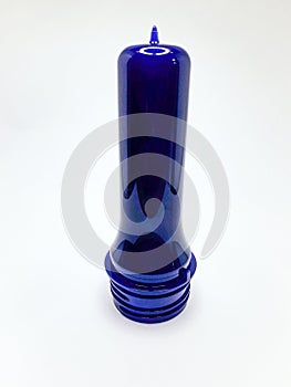 transparent dark blue preform isolated on a white background, This polymer is the form before it becomes a plastic bottle