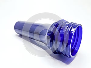 transparent dark blue preform isolated on a white background,This polymer is the form before it becomes a plastic bottle