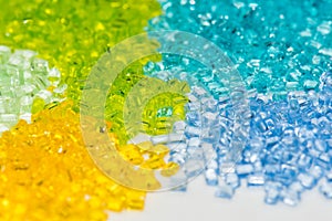 Transparent dyed plastic granulates photo