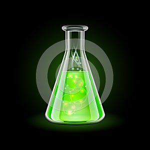 Transparent flask with magic green liquid on black