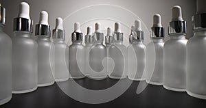 Transparent frosted plastic bottles on dark background