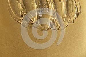 Transparent gel texture on gold metallic background