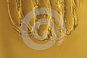 Transparent gel texture on gold metallic background