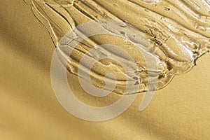 Transparent gel texture on gold metallic background