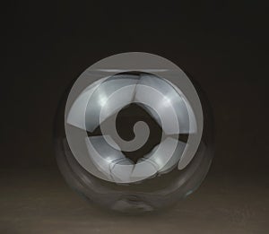 transparent glass ball on black background