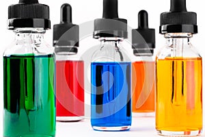 Transparent glass bottles filled colored liquid with dropper