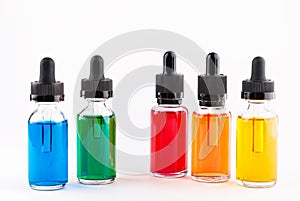 Transparent glass bottles filled colored liquid with dropper