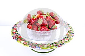 Transparent glass bowl with strawberries