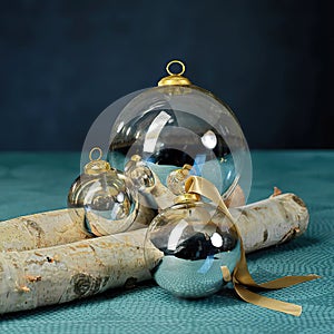 Transparent glass Christmas balls, blue background.