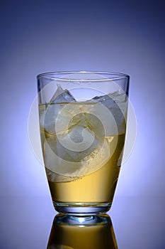 Transparent glass with drink and ice, advertising photography, selective focus