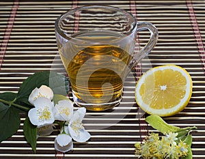 The transparent glass of lime tea and lemon