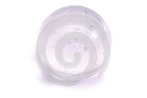 Transparent glass sphere with inclusions on a white background