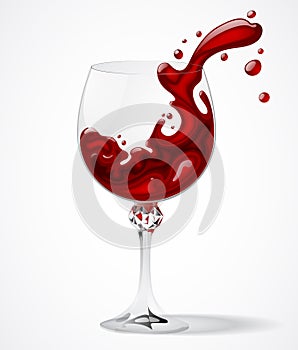 Transparent glass with splashed red wine on white background photo