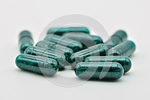 Transparent green pills