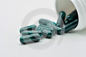 Transparent green pills photo