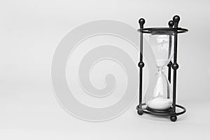 Transparent hourglass, White background. On the right. Copy, text space