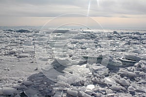 Transparent ice against the cloudy sky.