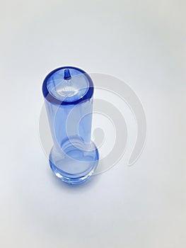 transparent light blue preform isolated on a white background,This polymer is the form before it becomes a plastic bottle