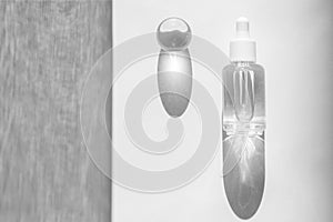 Transparent liquid product packaging in glass bottle. Hyaluronic acid oil mockup. Anti aging serum with collagen and