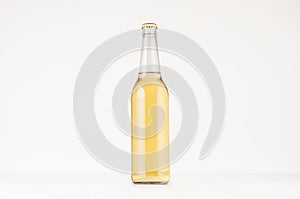 Transparent longneck beer bottle 500ml with lager, mock up. Template for advertising, design, branding identity on white wood tabl
