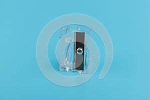 Transparent Pencil Sharpener. Photo of one pencil-sharpener on a blue background