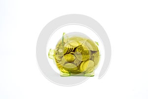 Transparent piggy bank with coins