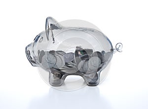 Transparent piggy bank, glass, shiny, isolated on white with coins, USA dimes inside, 3d render