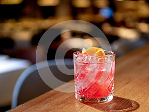 Transparent pink alcohol cocktail, vodka gin-tonic