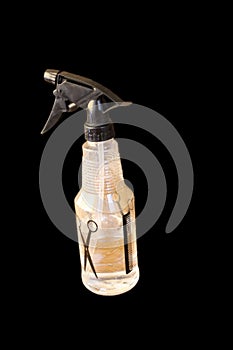 Transparent plastic bottle with black sprayer