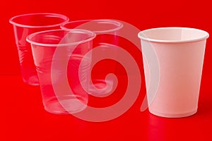 Transparent plastic disposable cups and an eco-friendly paper cup