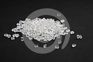 transparent plastic granules on black background.close-up. polymer industry