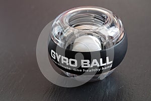 Transparent plastic gyroball on black background