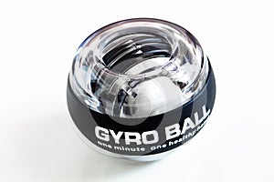 Transparent plastic gyroball on black background