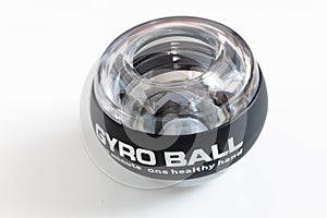 Transparent plastic gyroball on black background