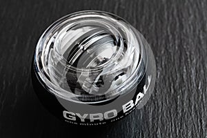 Transparent plastic gyroball on black background