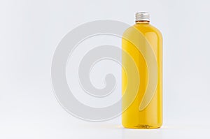 Transparent plastic tall bottle with orange drink  cooking oil or cosmetic produce  silver cap mockup on white background.