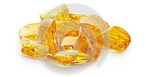 Transparent polished pieces of yellow amber on a white background. Sun stone. Natural mineral material for jewelry