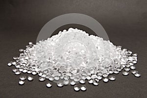 Transparent Polyethylene granules on dark .HDPE Plastic pellets. Plastic Raw material . IDPE.